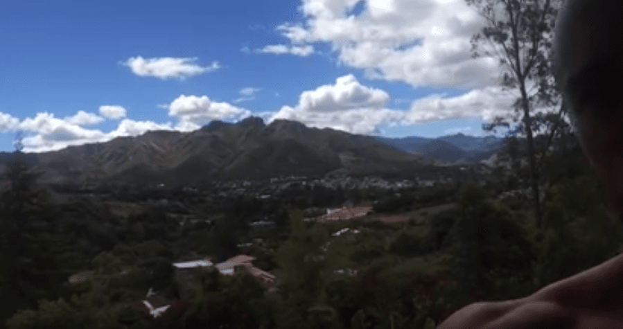 A small village below the mountain range.