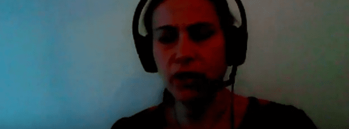 A woman wearing a headset.