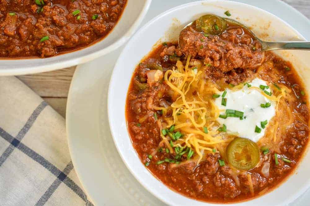 Easy keto ground beef chili in a white bowl.