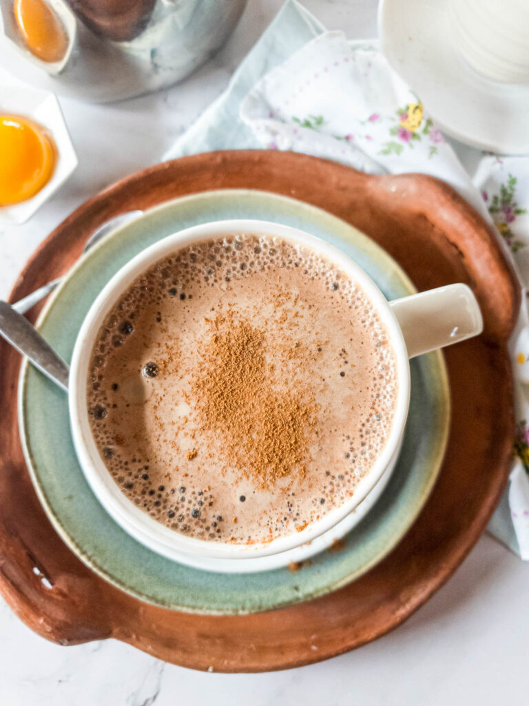 A picture of bone broth coffee latte with cinnamon dust as garnish.