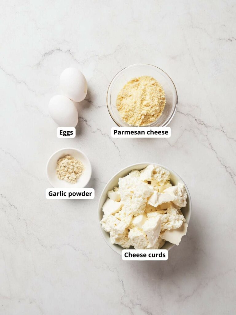 Ingredients for cheese curds on a marble counter.