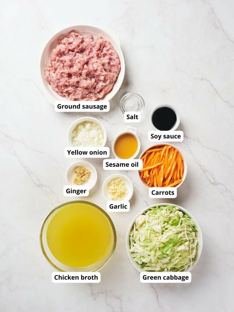 Ingredients for egg roll soup on a marble surface.