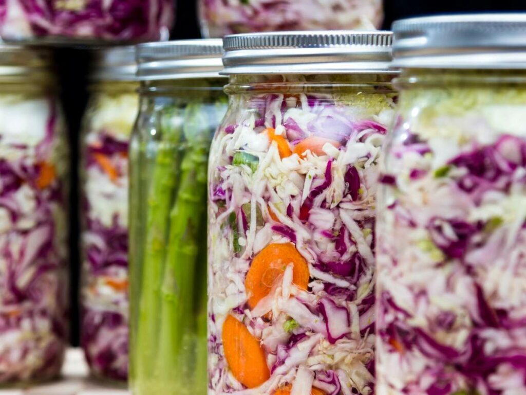 Close-up of jars filled with pickled vegetables.