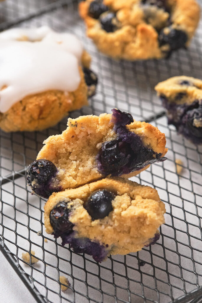 Close-up of a sliced blueberry scone showing a soft, crumbly texture.