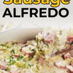 A dish of sausage Alfredo with chopped vegetables in a skillet, captioned "The Perfect Sausage Alfredo" above and "primalsedgehealth.com" below.
