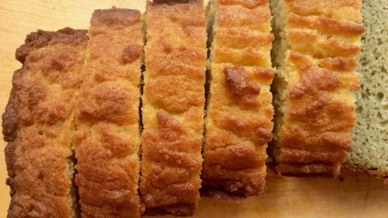 Coconut flour bread sliced on cutting board.