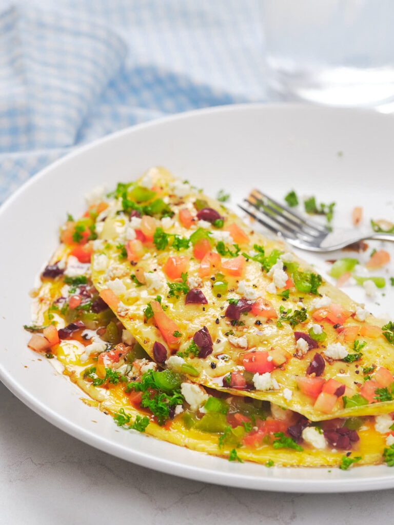 A white plate with a serving of Mediterranean omelet.