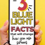 Hand holding a smartphone displaying text: "3 Blue Light Facts that will change how you use screens" against a yellow background.